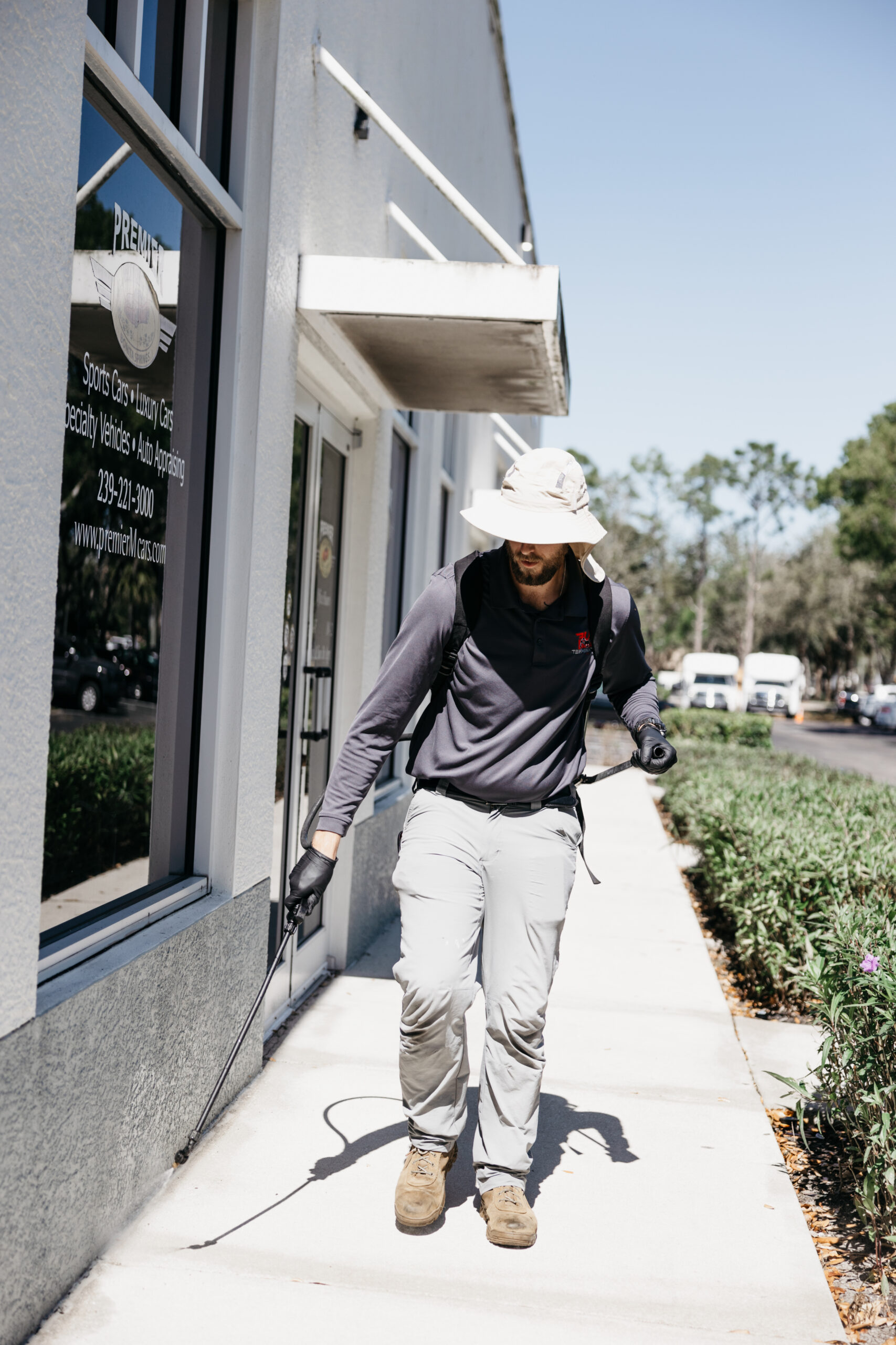 Pest control technician performing service